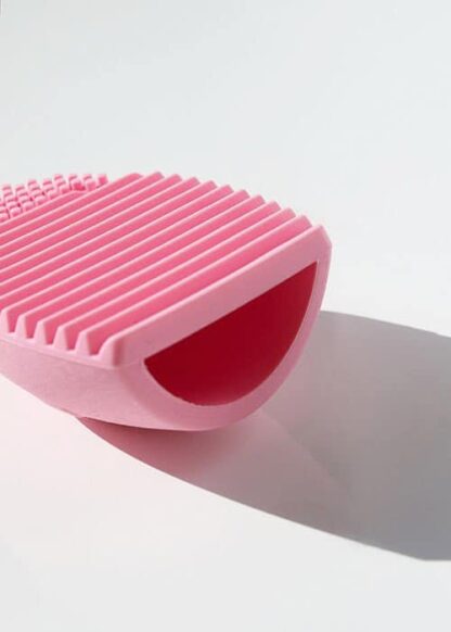 brush cleaning egg light pink